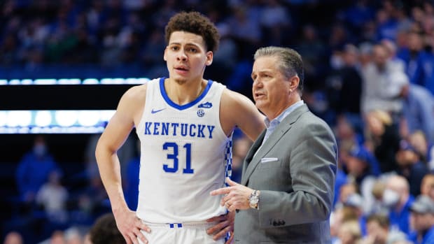 Kentucky Wildcats head coach John Calipari talks with Kentucky Wildcats guard Kellan Grady (31) during the second half against the Alabama Crimson Tide at Rupp Arena at Central Bank Center.